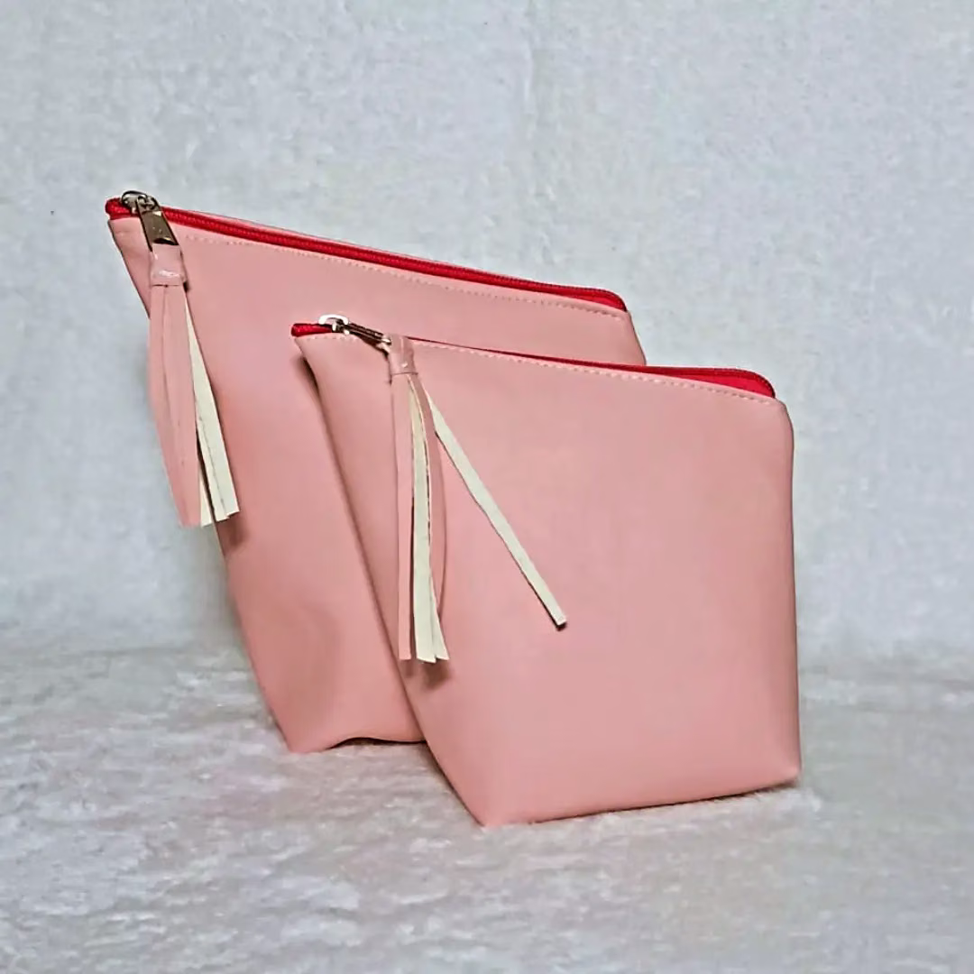 Dos materas rosa con cierre fucsia y borla